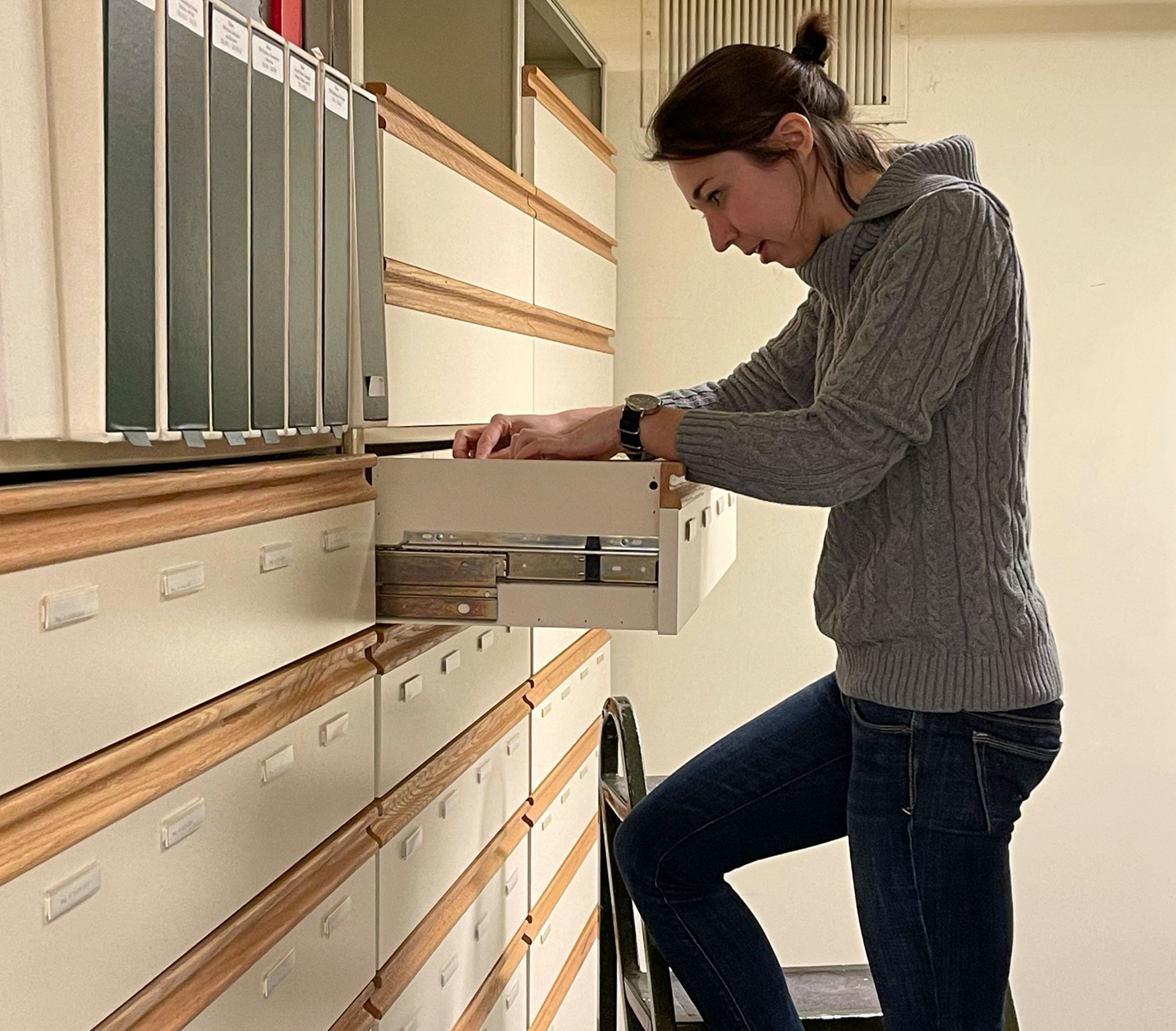 Oshkosh Public Museum staff member in the archives