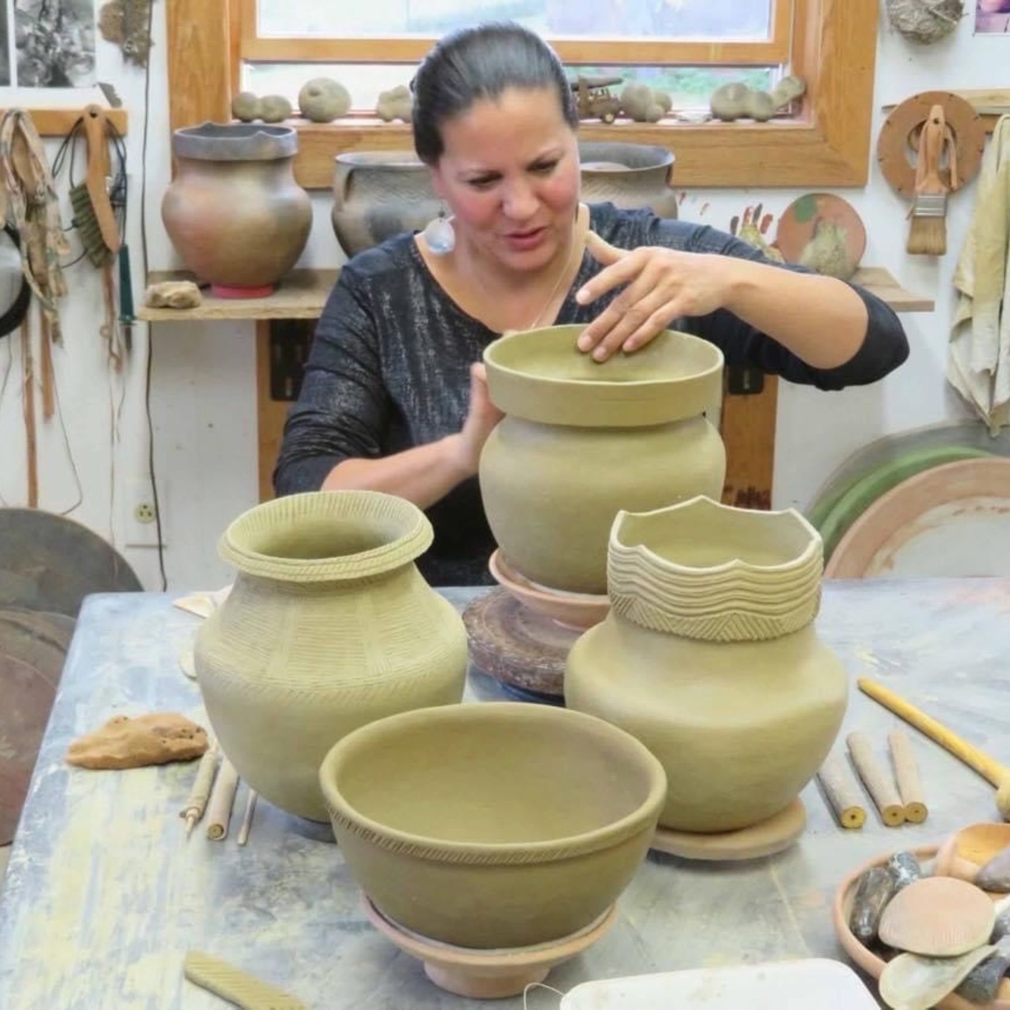 Jennifer M Stevens creating Oneida pottery with traditional methods 