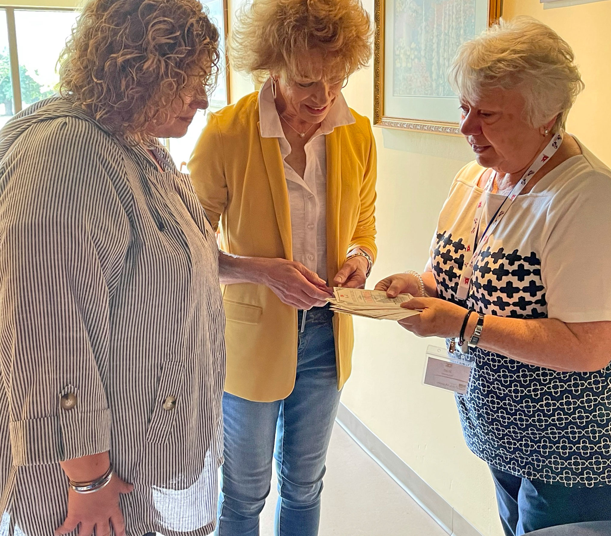 Oshkosh Public Museum docent assisting visitors